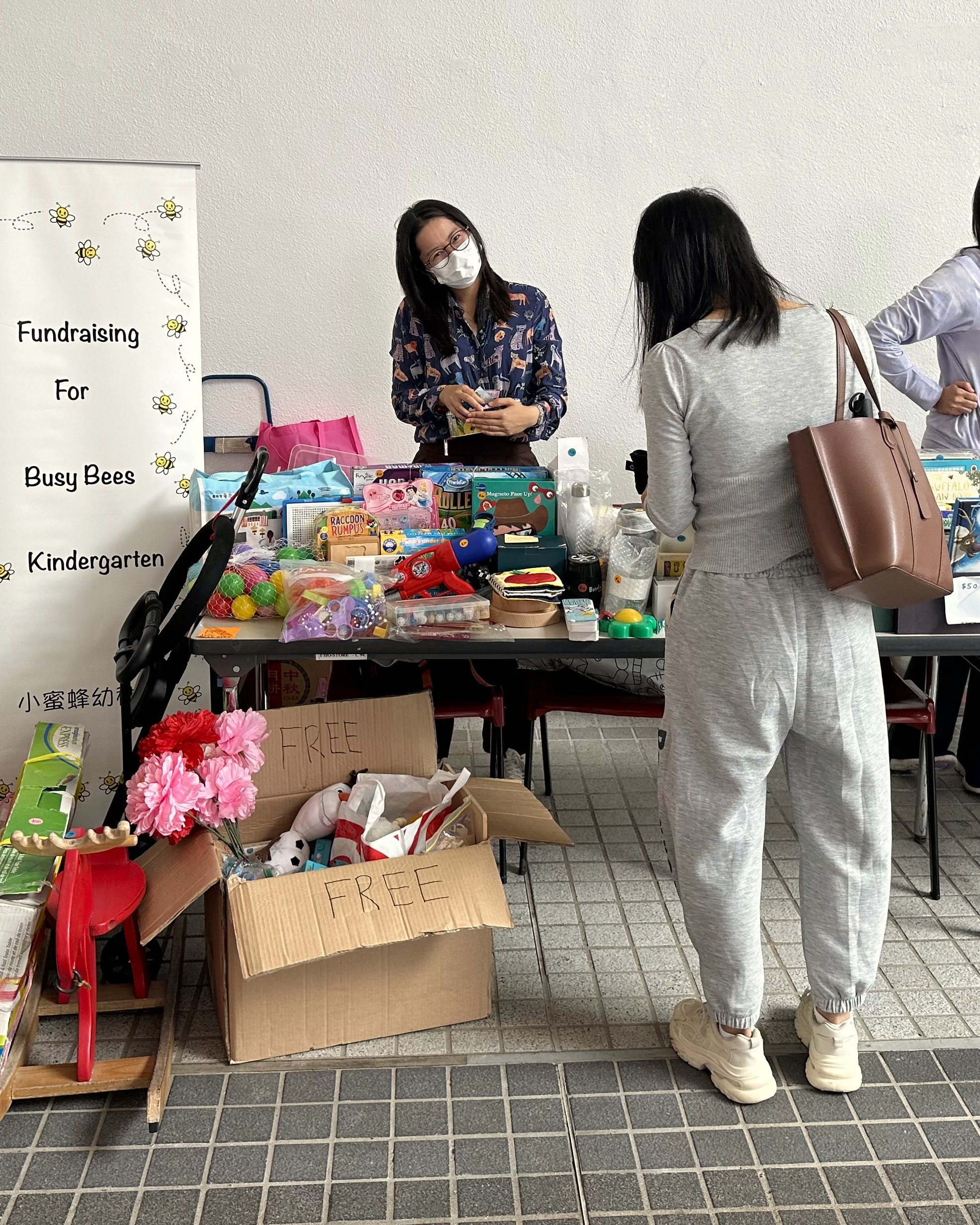 parent volunteers at the garage sale